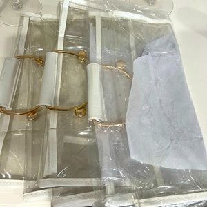 3 clear vinyl stadium bags with gold hardware